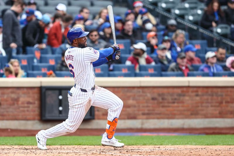 Apr 13, 2024; New York City, New York, USA;  New York Mets right fielder Starling Marte (6) hits a solo home run in the eighth inning against the Kansas City Royals at Citi Field. Mandatory Credit: Wendell Cruz-USA TODAY Sports