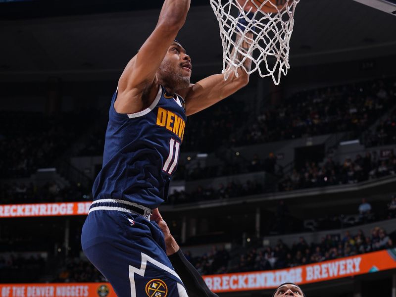 DENVER, CO - JANUARY 17: Bruce Brown #11 of the Denver Nuggets dunks the ball during the game against the Portland Trail Blazers on January 17, 2023 at the Ball Arena in Denver, Colorado. NOTE TO USER: User expressly acknowledges and agrees that, by downloading and/or using this Photograph, user is consenting to the terms and conditions of the Getty Images License Agreement. Mandatory Copyright Notice: Copyright 2023 NBAE (Photo by Bart Young/NBAE via Getty Images)