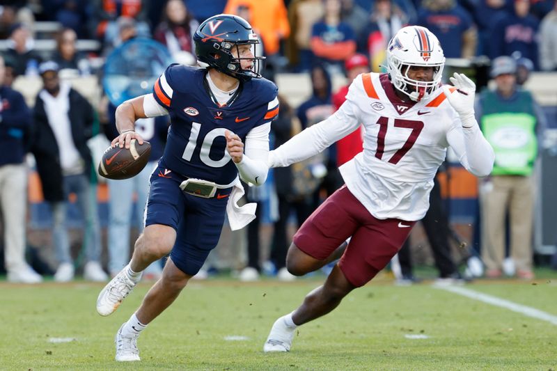 Nov 25, 2023; Charlottesville, Virginia, USA; Virginia Cavaliers quarterback Anthony Colandrea (10) scrambles from Virginia Tech Hokies defensive lineman Cole Nelson (17) during the first quarter at Scott Stadium. Mandatory Credit: Geoff Burke-USA TODAY Sports