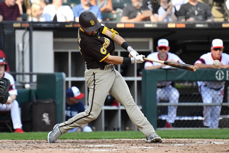 Oct 1, 2023; Chicago, Illinois, USA; San Diego Padres second baseman Matthew Batten (17) hits a single during the sixth inning against the Chicago White Sox at Guaranteed Rate Field. Mandatory Credit: Patrick Gorski-USA TODAY Sports