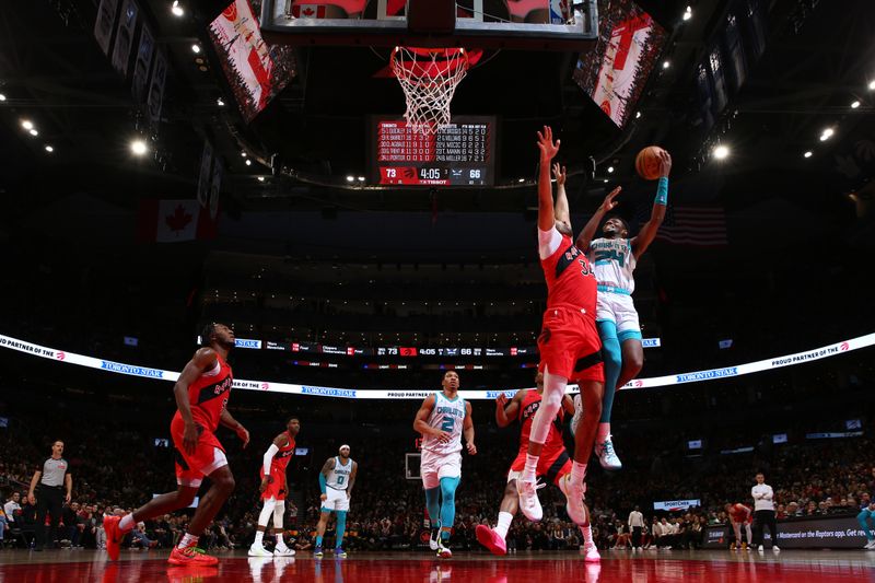 TORONTO, CANADA - MARCH 3: Brandon Miller #24 of the Charlotte Hornets drives to the basket during the game against the Toronto Raptors on March 3, 2024 at the Scotiabank Arena in Toronto, Ontario, Canada.  NOTE TO USER: User expressly acknowledges and agrees that, by downloading and or using this Photograph, user is consenting to the terms and conditions of the Getty Images License Agreement.  Mandatory Copyright Notice: Copyright 2024 NBAE (Photo by Vaughn Ridley/NBAE via Getty Images)