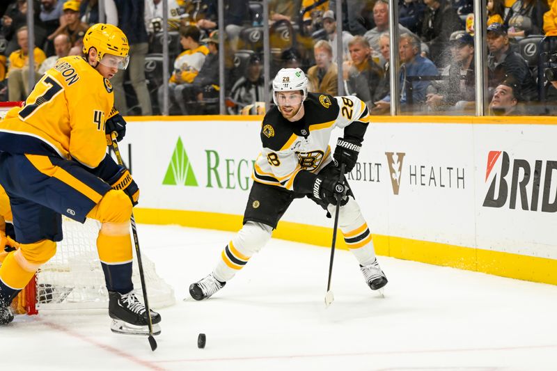 Oct 22, 2024; Nashville, Tennessee, USA; Nashville Predators right wing Michael McCarron (47) blocks the pass of Boston Bruins center Elias Lindholm (28) during the second period at Bridgestone Arena. Mandatory Credit: Steve Roberts-Imagn Images