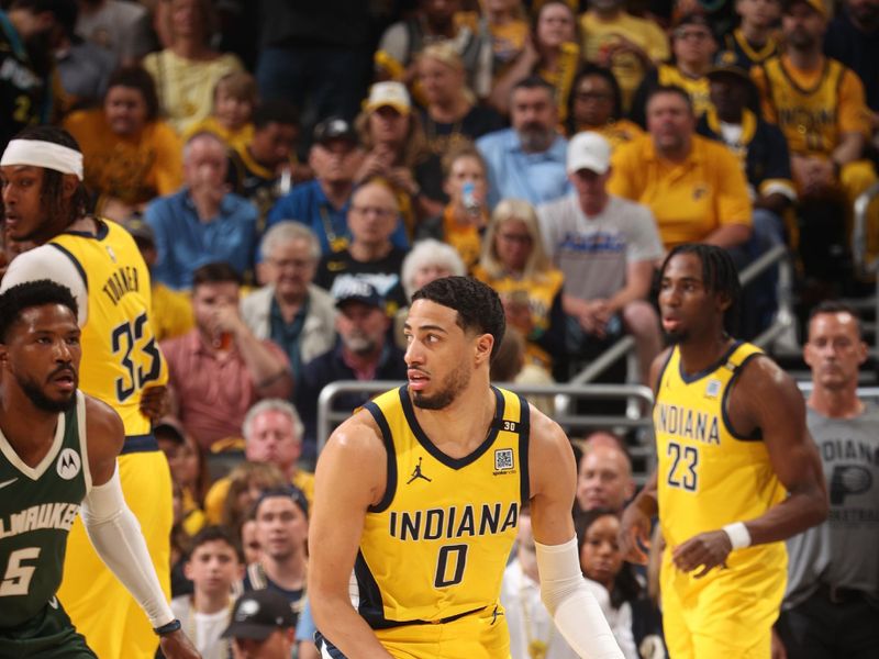 INDIANAPOLIS, IN - APRIL 28: Tyrese Haliburton #0 of the Indiana Pacers dribbles the ball during the game against the Milwaukee Bucks during Round 1 Game 4 of the 2024 NBA Playoffs on April 28, 2024 at Gainbridge Fieldhouse in Indianapolis, Indiana. NOTE TO USER: User expressly acknowledges and agrees that, by downloading and or using this Photograph, user is consenting to the terms and conditions of the Getty Images License Agreement. Mandatory Copyright Notice: Copyright 2024 NBAE (Photo by Nathaniel S. Butler/NBAE via Getty Images)