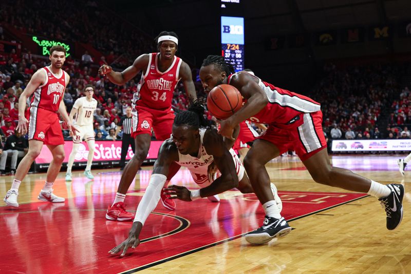 Mar 10, 2024; Piscataway, New Jersey, USA; Ohio State Buckeyes guard Bruce Thornton (2) battles for the ball against Rutgers Scarlet Knights center Clifford Omoruyi (11) during the second half at Jersey Mike's Arena. Mandatory Credit: Vincent Carchietta-USA TODAY Sports