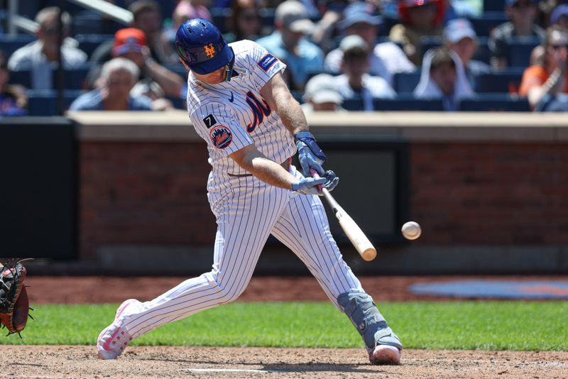 May 11, 2025; New York City, New York, USA; New York Mets first baseman Pete Alonso (20) hits a double during the eighth inning against the Chicago Cubs at Citi Field. Mandatory Credit: Vincent Carchietta-Imagn Images