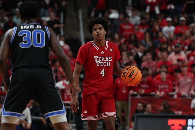 Jan 17, 2026; Lubbock, Texas, USA;  Texas Tech Red Raiders guard Christian Anderson (4) brings the ball up court against BYU Cougars guard Kennard Davis Jr. (30) in the second half at United Supermarkets Arena. Mandatory Credit: Michael C. Johnson-Imagn Images