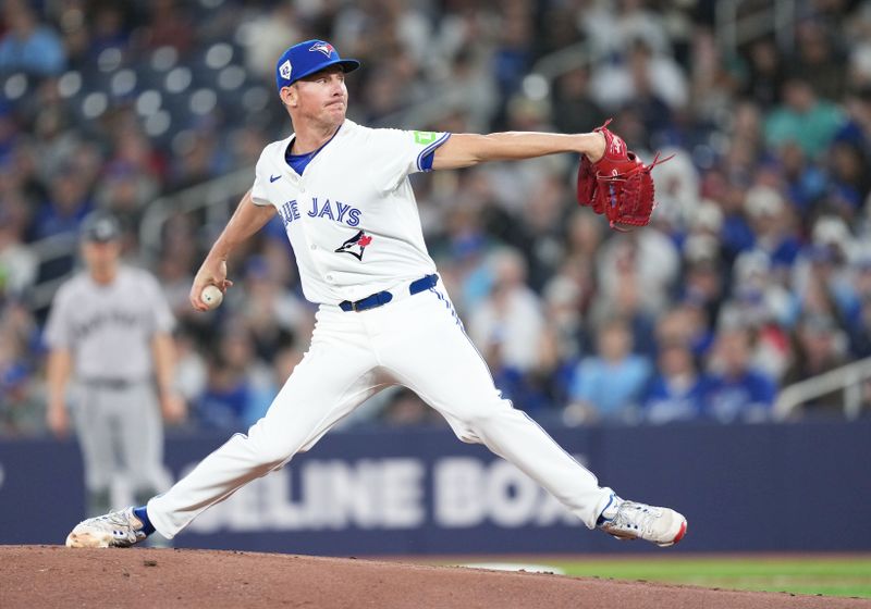 Apr 15, 2024; Toronto, Ontario, CAN; Toronto Blue Jays pitcher Chris Bassitt wearing number 42 for Jackie Robinson Day throws a pitch against the New York Yankees during the first inning at Rogers Centre. Mandatory Credit: Nick Turchiaro-USA TODAY Sports