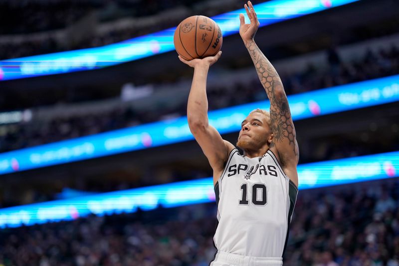 DALLAS, TEXAS - DECEMBER 23: Jeremy Sochan #10 of the San Antonio Spurs shoots during the first half of the game against the Dallas Mavericks at American Airlines Center on December 23, 2023 in Dallas, Texas. NOTE TO USER: User expressly acknowledges and agrees that, by downloading and or using this photograph, User is consenting to the terms and conditions of the Getty Images License Agreement.  (Photo by Sam Hodde/Getty Images)