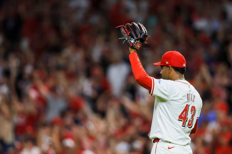 Jun 12, 2024; Cincinnati, Ohio, USA; Cincinnati Reds relief pitcher Alexis Diaz (43) reacts after the victory over the Cleveland Guardians at Great American Ball Park. Mandatory Credit: Katie Stratman-USA TODAY Sports