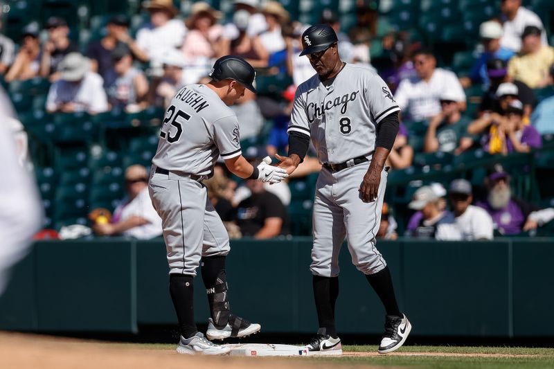 Aug 20, 2023; Denver, Colorado, USA; Chicago White Sox designated hitter Andrew Vaughn (25) reacts with first base coach Daryl Boston (8) after hitting a single to load the bases in the eighth inning against the Colorado Rockies at Coors Field. Mandatory Credit: Isaiah J. Downing-USA TODAY Sports