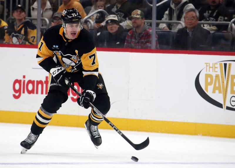 Nov 22, 2024; Pittsburgh, Pennsylvania, USA;  Pittsburgh Penguins center Evgeni Malkin (71) skates up ice with the puck against the Winnipeg Jets during the first period at PPG Paints Arena. Mandatory Credit: Charles LeClaire-Imagn Images