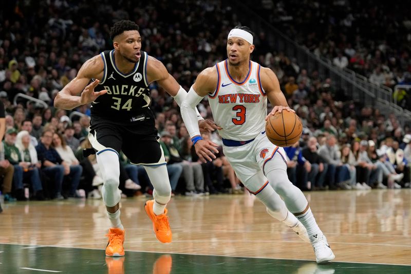 MILWAUKEE, WISCONSIN - APRIL 07: Josh Hart #3 of the New York Knicks dribbles the ball against Giannis Antetokounmpo #34 of the Milwaukee Bucks during the second half at Fiserv Forum on April 07, 2024 in Milwaukee, Wisconsin. NOTE TO USER: User expressly acknowledges and agrees that, by downloading and or using this photograph, User is consenting to the terms and conditions of the Getty Images License Agreement. (Photo by Patrick McDermott/Getty Images)