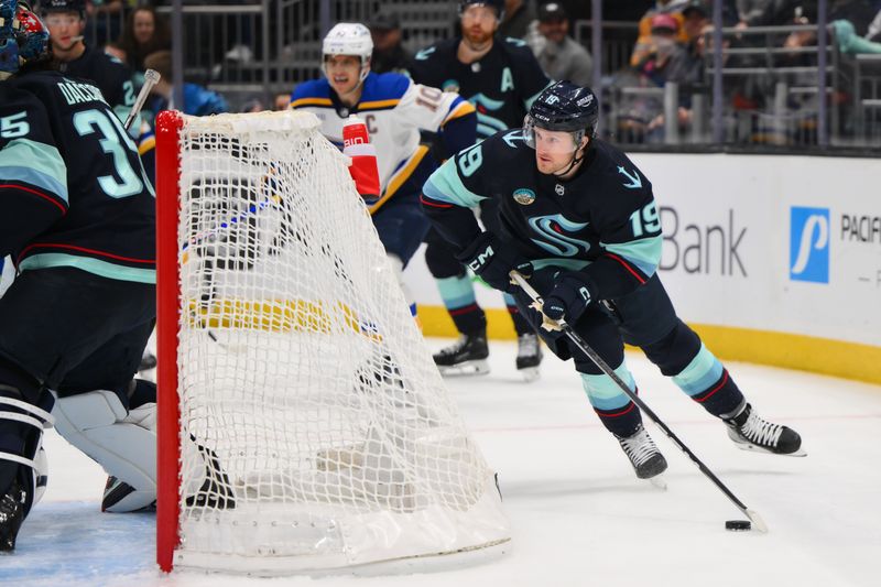 Jan 26, 2024; Seattle, Washington, USA; Seattle Kraken left wing Jared McCann (19) plays the puck behind the goal during the first period against the St. Louis Blues at Climate Pledge Arena. Mandatory Credit: Steven Bisig-USA TODAY Sports