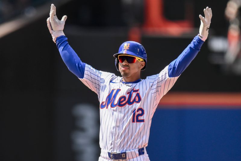 May 2, 2024; New York City, New York, USA; New York Mets shortstop Francisco Lindor (12) reacts after hitting a two RBI double against the Chicago Cubs during the sixth inning at Citi Field. Mandatory Credit: John Jones-USA TODAY Sports