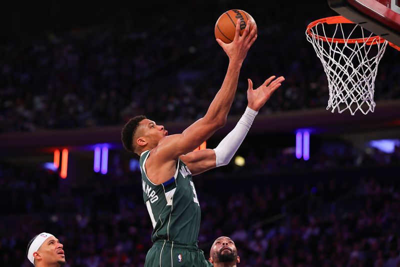 NEW YORK, NEW YORK - DECEMBER 25:  Giannis Antetokounmpo #34 of the Milwaukee Bucks drives to the basket during the third quarter against the New York Knicks at Madison Square Garden on December 25, 2023 in New York City.  NOTE TO USER: User expressly acknowledges and agrees that, by downloading and or using this photograph, User is consenting to the terms and conditions of the Getty Images License Agreement. (Photo by Rich Graessle/Getty Images)