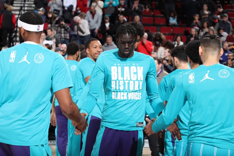 PORTLAND, OR - FEBRUARY 25:  JT Thor #21 of the Charlotte Hornets walks on the court during player introductions  on February 25, 2024 at the Moda Center Arena in Portland, Oregon. NOTE TO USER: User expressly acknowledges and agrees that, by downloading and or using this photograph, user is consenting to the terms and conditions of the Getty Images License Agreement. Mandatory Copyright Notice: Copyright 2024 NBAE (Photo by Cameron Browne/NBAE via Getty Images)