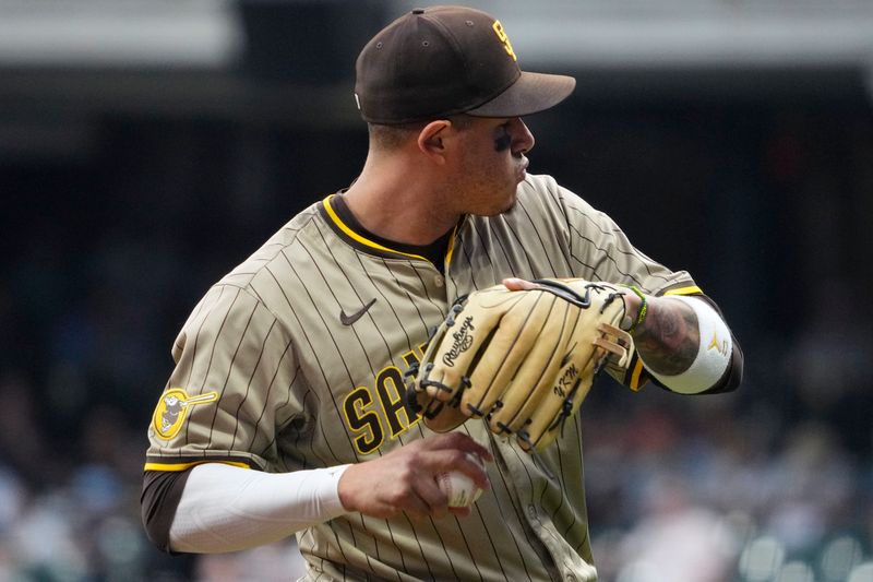 Jun 7, 2025; Milwaukee, Wisconsin, USA; San Diego Padres third base Manny Machado (13) warms up between the fourth innings against the Milwaukee Brewers  at American Family Field. Mandatory Credit: Michael McLoone-Imagn Images