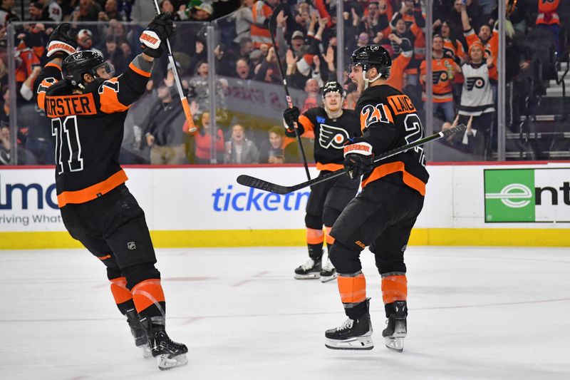 Mar 19, 2024; Philadelphia, Pennsylvania, USA; Philadelphia Flyers center Scott Laughton (21) celebrates his goal with right wing Tyson Foerster (71) and right wing Owen Tippett (74) against the Toronto Maple Leafs during the third period at Wells Fargo Center. Mandatory Credit: Eric Hartline-USA TODAY Sports