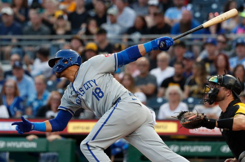 Sep 13, 2024; Pittsburgh, Pennsylvania, USA;  Kansas City Royals first baseman Yuli Gurriel (18) hits an RBI single against the Pittsburgh Pirates during the second inning at PNC Park. Mandatory Credit: Charles LeClaire-Imagn Images