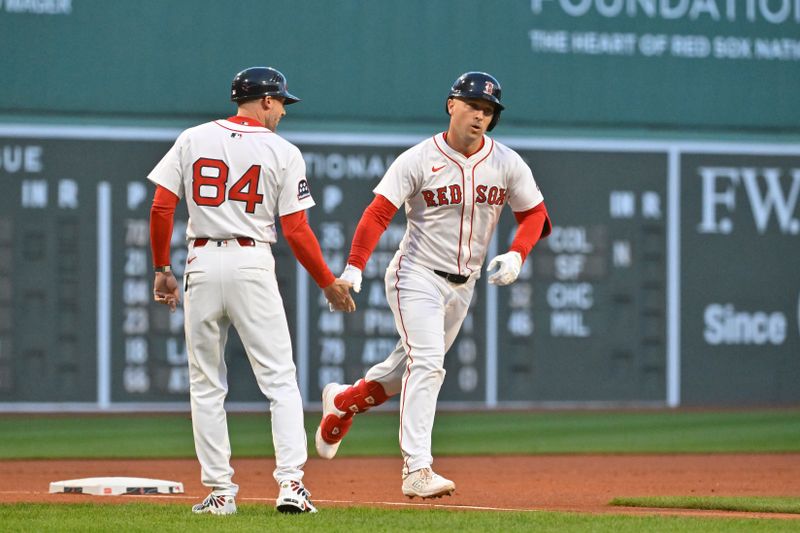 May 2, 2025; Boston, Massachusetts, USA; Boston Red Sox third baseman Alex Bregman (2) celebrates his home run against the Minnesota Twins with third base coach/outfield instructor Kyle Hudson (84) during the first inning at Fenway Park. Mandatory Credit: Eric Canha-Imagn Images