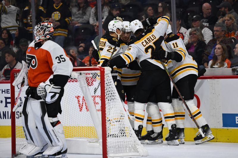 Nov 2, 2024; Philadelphia, Pennsylvania, USA; The Boston Bruins celebrate a goal from center Matthew Poitras (51) against the Philadelphia Flyers in the first period at Wells Fargo Center. Mandatory Credit: Kyle Ross-Imagn Images