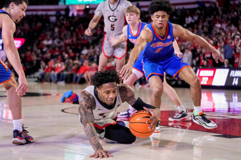 Feb 17, 2024; Athens, Georgia, USA; Georgia Bulldogs guard Justin Hill (11) dives for the ball behind Florida Gators guard Zyon Pullin (0) during the first half at Stegeman Coliseum. Mandatory Credit: Dale Zanine-USA TODAY Sports