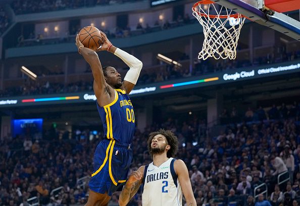 SAN FRANCISCO, CALIFORNIA - DECEMBER 30: Jonathan Kuminga #00 of the Golden State Warriors goes up for a slam dunk against the Dallas Mavericks during the first quarter at Chase Center on December 30, 2023 in San Francisco, California. NOTE TO USER: User expressly acknowledges and agrees that, by downloading and or using this photograph, User is consenting to the terms and conditions of the Getty Images License Agreement. (Photo by Thearon W. Henderson/Getty Images)