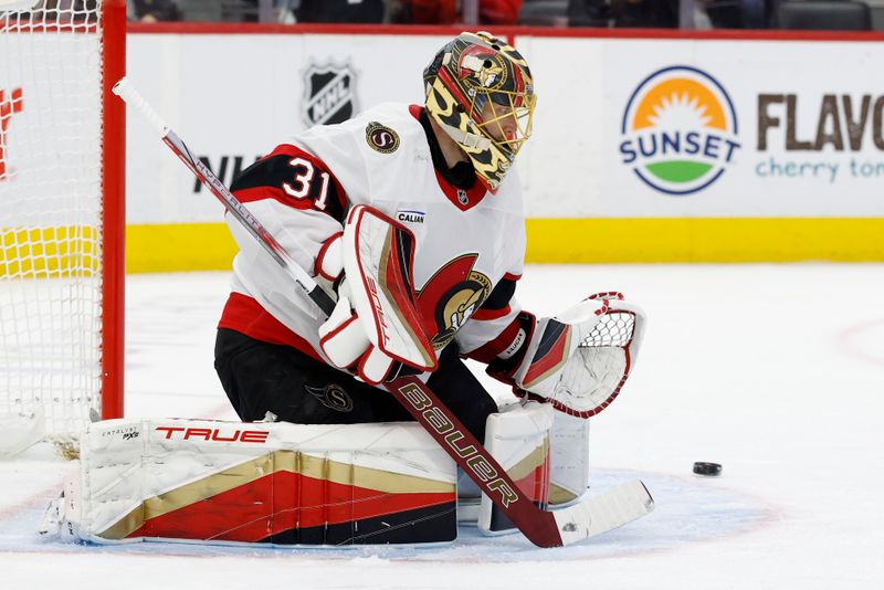 Jan 7, 2025; Detroit, Michigan, USA; Ottawa Senators goaltender Anton Forsberg (31) makes a save in the second period against the Detroit Red Wings at Little Caesars Arena. Mandatory Credit: Rick Osentoski-Imagn Images