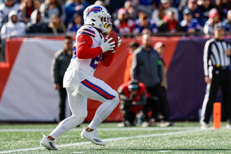 Buffalo Bills running back Ty Johnson (26) carries the ball during the first half of an NFL football game against the New England Patriots on Sunday, Oct. 22, 2023, in Foxborough, Mass. (AP Photo/Greg M. Cooper)