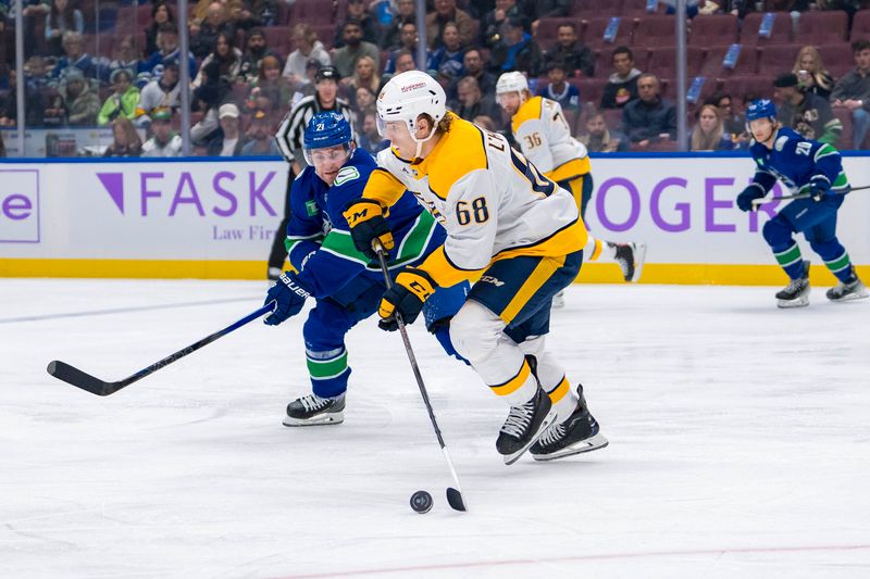 Nov 17, 2024; Vancouver, British Columbia, CAN; Vancouver Canucks forward Nils Hoglander (21) defends against Nashville Predators forward Zachary L'Heureux (68) during the first period at Rogers Arena. Mandatory Credit: Bob Frid-Imagn Images