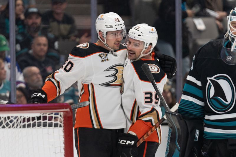 Feb 29, 2024; San Jose, California, USA; Anaheim Ducks right wing Brett Leason (20) and center Sam Carrick (39) celebrate during the first period against the San Jose Sharks at SAP Center at San Jose. Mandatory Credit: Stan Szeto-USA TODAY Sports