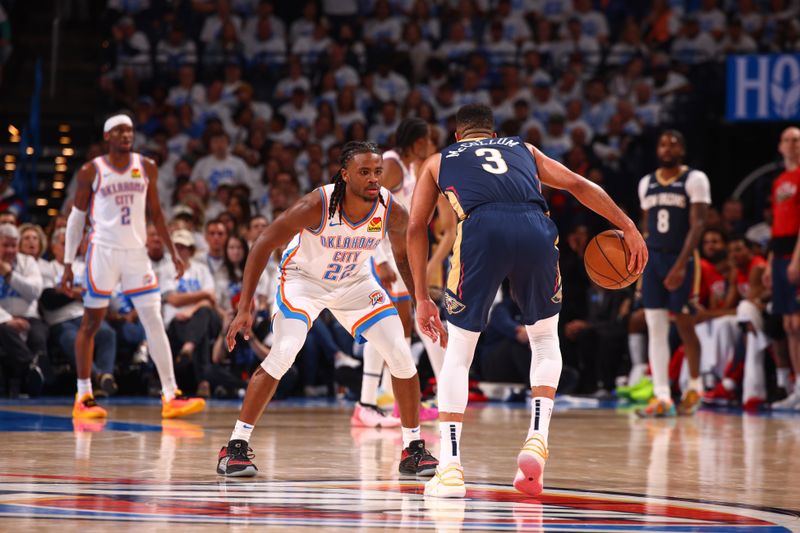 OKLAHOMA CITY, OK - APRIL 21:  Cason Wallace #22 of the Oklahoma City Thunder  plays defense during the game  against CJ McCollum #3 of the New Orleans Pelicans during Round 1 Game 1 of the 2024 NBA Playoffs on April 21, 2024 at Paycom Arena in Oklahoma City, Oklahoma. NOTE TO USER: User expressly acknowledges and agrees that, by downloading and or using this photograph, User is consenting to the terms and conditions of the Getty Images License Agreement. Mandatory Copyright Notice: Copyright 2024 NBAE (Photo by Zach Beeker/NBAE via Getty Images)