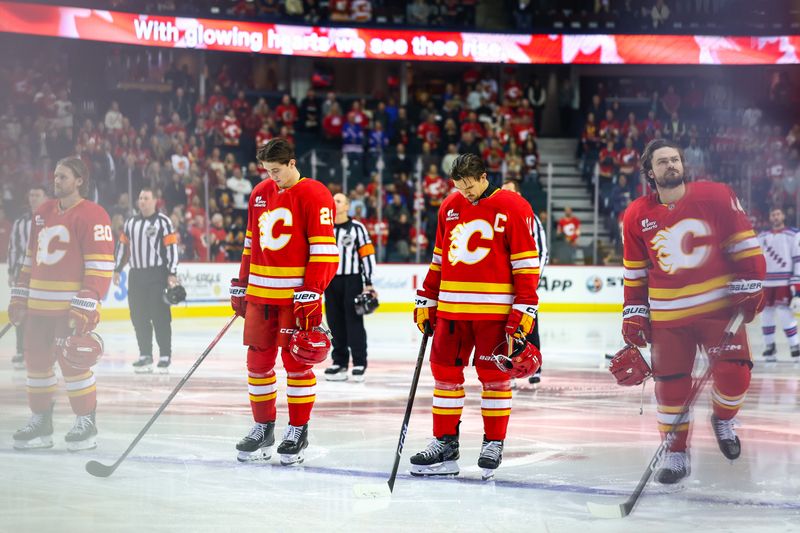 Oct 26, 2025; Calgary, Alberta, CAN; Calgary Flames center Mikael Backlund (11) during the national anthem prior to the game against the New York Rangers at Scotiabank Saddledome. Mandatory Credit: Sergei Belski-Imagn Images