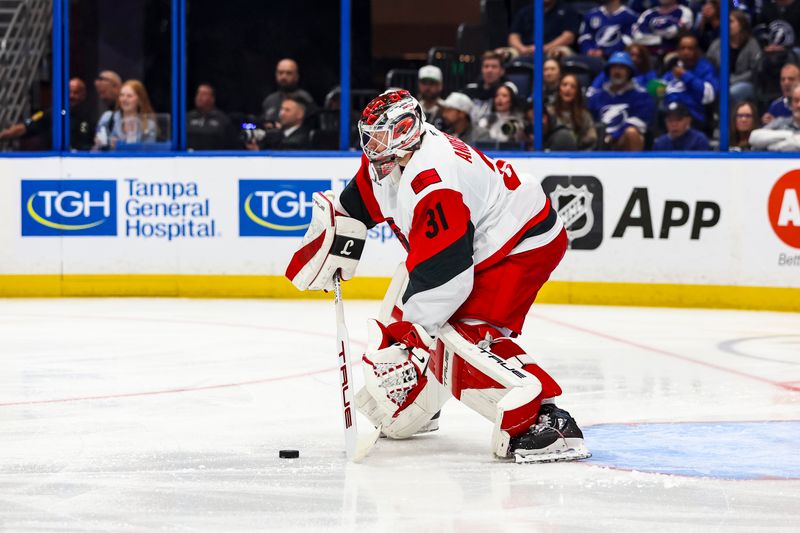 Mar 14, 2026; Tampa, Florida, USA; Carolina Hurricanes goalkeeper Frederick Andersen (31) handles the puck against the Tampa Bay Lightning in the first period at Benchmark International Arena. Mandatory Credit: Morgan Tencza-Imagn Images Mar 14, 2026; Tampa, Florida, USA; Carolina Hurricanes goalkeeper Frederick Andersen (31) handles the puck against the Tampa Bay Lightning in the first period at Benchmark International Arena. Mandatory Credit: Morgan Tencza-Imagn Images