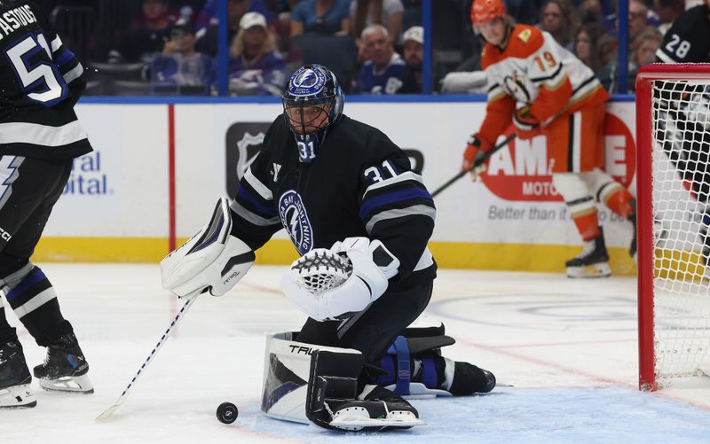 Oct 25, 2025; Tampa, Florida, USA; Tampa Bay Lightning goaltender Jonas Johansson (31) stops the puck against the Anaheim Ducks  during the second period at Benchmark International Arena. Mandatory Credit: Kim Klement Neitzel-Imagn Images