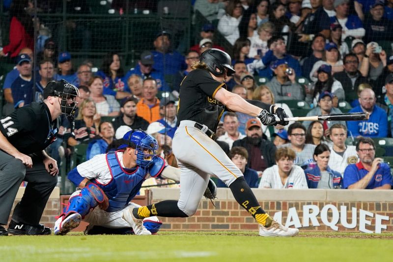 Sep 21, 2023; Chicago, Illinois, USA; Pittsburgh Pirates center fielder Jack Suwinski (65) hits a single against the Chicago Cubs during the fifth inning at Wrigley Field. Mandatory Credit: David Banks-USA TODAY Sports