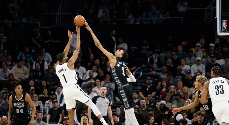 SAN ANTONIO, TX - MARCH 17  Victor Wembanyama #1 of the San Antonio Spurs blocks the shot of Mikal Bridges #1 of the Brooklyn Nets in the first half at Moody Center on March 17, 2024 in San Antonio, Texas. NOTE TO USER: User expressly acknowledges and agrees that, by downloading and or using this photograph, User is consenting to terms and conditions of the Getty Images License Agreement. (Photo by Ronald Cortes/Getty Images)