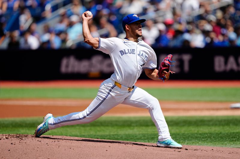 Jul 28, 2024; Toronto, Ontario, CAN; Toronto Blue Jays starting pitcher José Berríos (17) pitches to the Texas Rangers during the first inning at Rogers Centre. Mandatory Credit: John E. Sokolowski-USA TODAY Sports