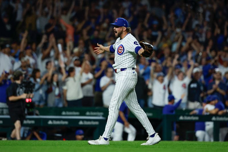 Sep 4, 2024; Chicago, Illinois, USA; Chicago Cubs relief pitcher Porter Hodge (37) celebrates teams win against the Pittsburgh Pirates in a baseball game at Wrigley Field. Mandatory Credit: Kamil Krzaczynski-Imagn Images