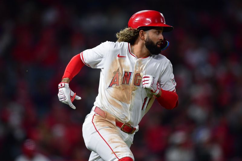 Sep 27, 2024; Anaheim, California, USA; Los Angeles Angels shortstop Jack Lopez (10) runs after hitting a double against the Texas Rangers during the third inning at Angel Stadium. Mandatory Credit: Gary A. Vasquez-Imagn Images