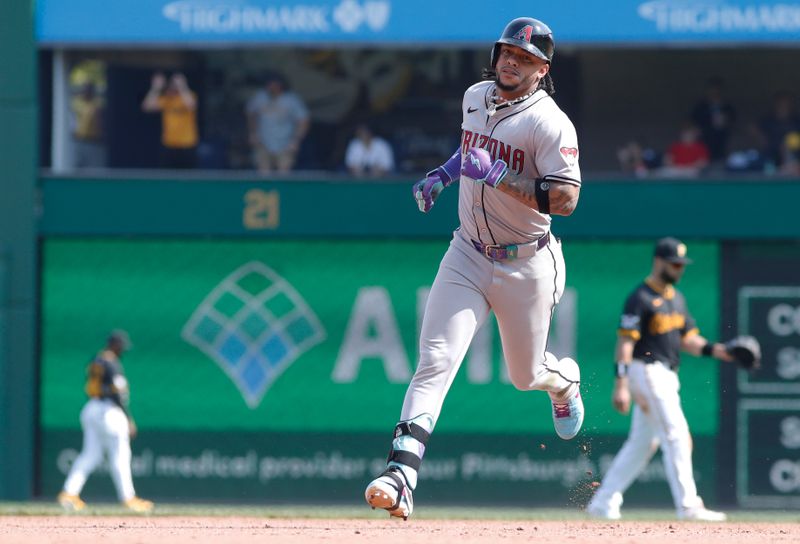 Aug 4, 2024; Pittsburgh, Pennsylvania, USA;  Arizona Diamondbacks second baseman Ketel Marte (4) circles the base on a solo home run against the Pittsburgh Pirates during the ninth inning at PNC Park. Mandatory Credit: Charles LeClaire-USA TODAY Sports