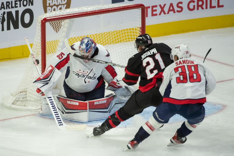 Oct 18, 2023; Ottawa, Ontario, CAN; Washington Capitals goalie Darcy Kuemper (35) makes a save on a shot by Ottawa Senators right wing Mathieu Joseph (21) in the third period at the Canadian Tire Centre. Mandatory Credit: Marc DesRosiers-USA TODAY Sports