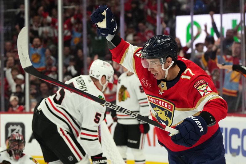 Nov 12, 2023; Sunrise, Florida, USA; Florida Panthers center Evan Rodrigues (17) celebrates the goal of center Sam Reinhart (not pictured) during the second period against the Chicago Blackhawks at Amerant Bank Arena. Mandatory Credit: Jasen Vinlove-USA TODAY Sports