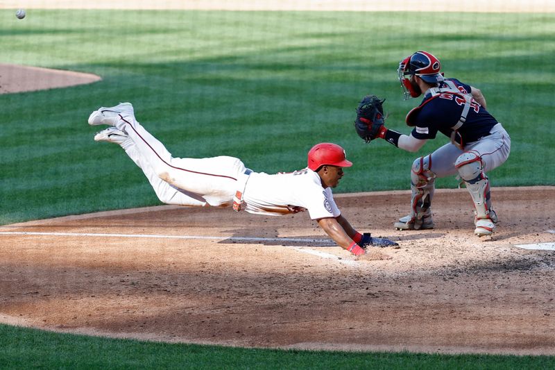 Aug 17, 2023; Washington, District of Columbia, USA; Washington Nationals second baseman Jeter Downs (3) scores a run ahead of a tag by Boston Red Sox catcher Connor Wong (12) on a two run double by Nationals designated hitter Joey Meneses (not pictured) during the fifth inning at Nationals Park. Mandatory Credit: Geoff Burke-USA TODAY Sports