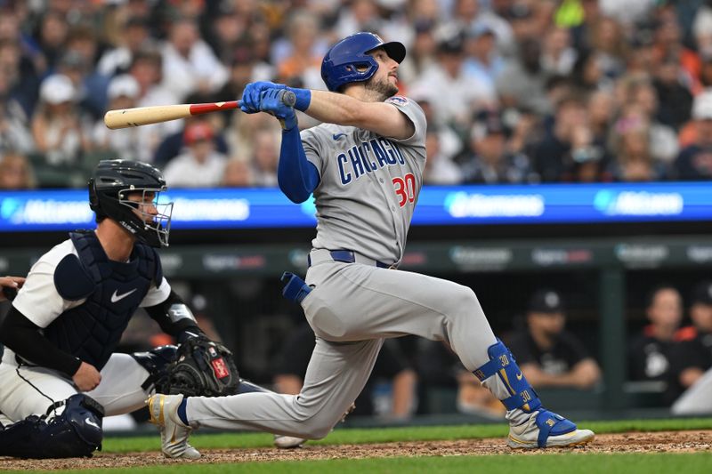 Jun 6, 2025; Detroit, Michigan, USA;  Chicago Cubs right fielder Kyle Tucker (30) hits an RBI double against the Detroit Tigers in the sixth inning at Comerica Park. Mandatory Credit: Lon Horwedel-Imagn Images