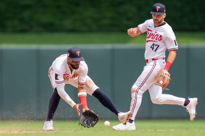 Jul 21, 2024; Minneapolis, Minnesota, USA; Minnesota Twins shortstop Willi Castro (50) fields a ground ball against the Milwaukee Brewers in the sixth inning at Target Field. Mandatory Credit: Matt Blewett-USA TODAY Sports