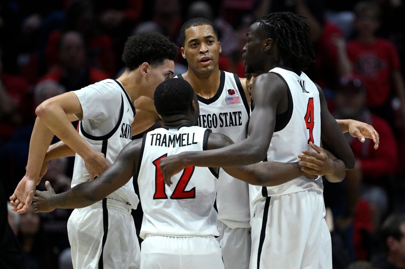 Feb 13, 2024; San Diego, California, USA; San Diego State Aztecs forward Jaedon LeDee (13) huddles with teammates during the second half against the Colorado State Rams at Viejas Arena. Mandatory Credit: Orlando Ramirez-USA TODAY Sports