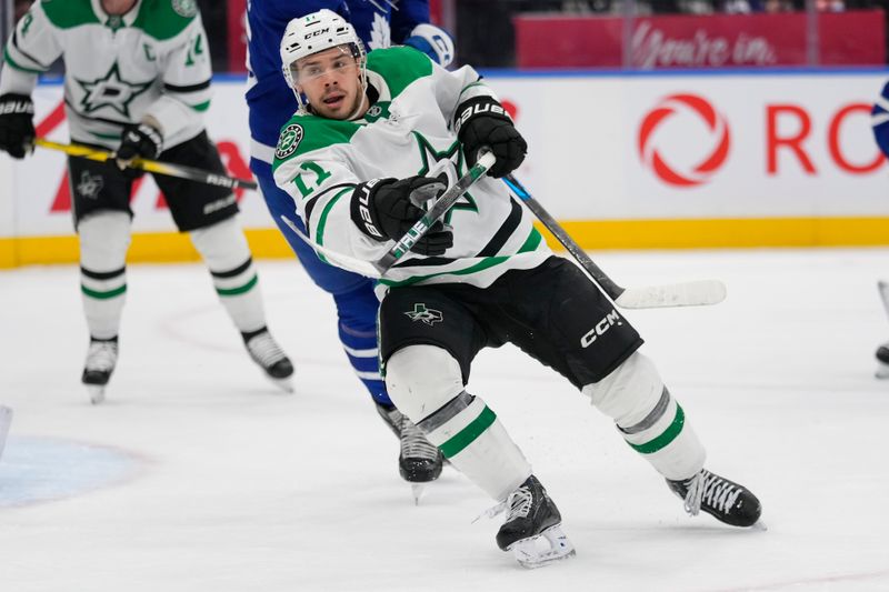 Jan 14, 2025; Toronto, Ontario, CAN; Dallas Stars forward Logan Stankoven (11) skates against the Toronto Maple Leafs during the second period at Scotiabank Arena. Mandatory Credit: John E. Sokolowski-Imagn Images