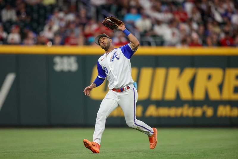 May 20, 2023; Atlanta, Georgia, USA; Atlanta Braves left fielder Eddie Rosario (8) catches a fly ball against the Seattle Mariners in the ninth inning at Truist Park. Mandatory Credit: Brett Davis-USA TODAY Sports
