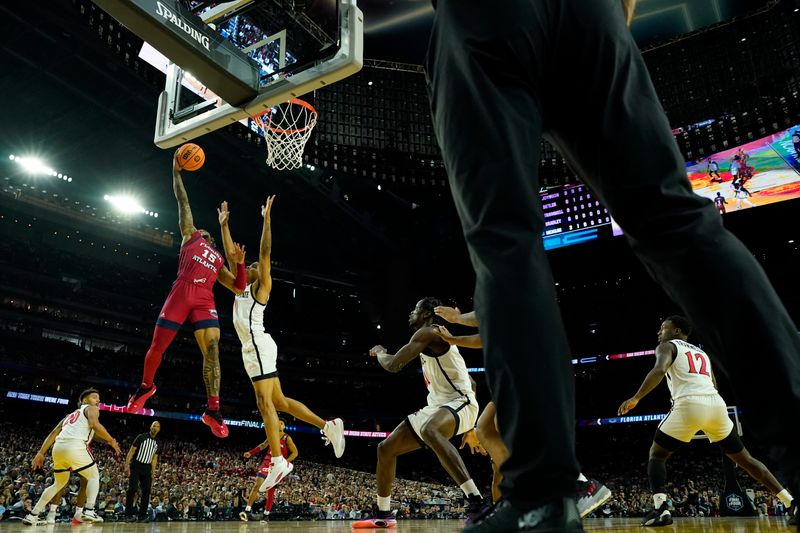 Apr 1, 2023; Houston, TX, USA; Florida Atlantic Owls guard Alijah Martin (15) shoots the ball against San Diego State Aztecs forward Keshad Johnson (0) during the first half in the semifinals of the Final Four of the 2023 NCAA Tournament at NRG Stadium. Mandatory Credit: Bob Donnan-USA TODAY Sports